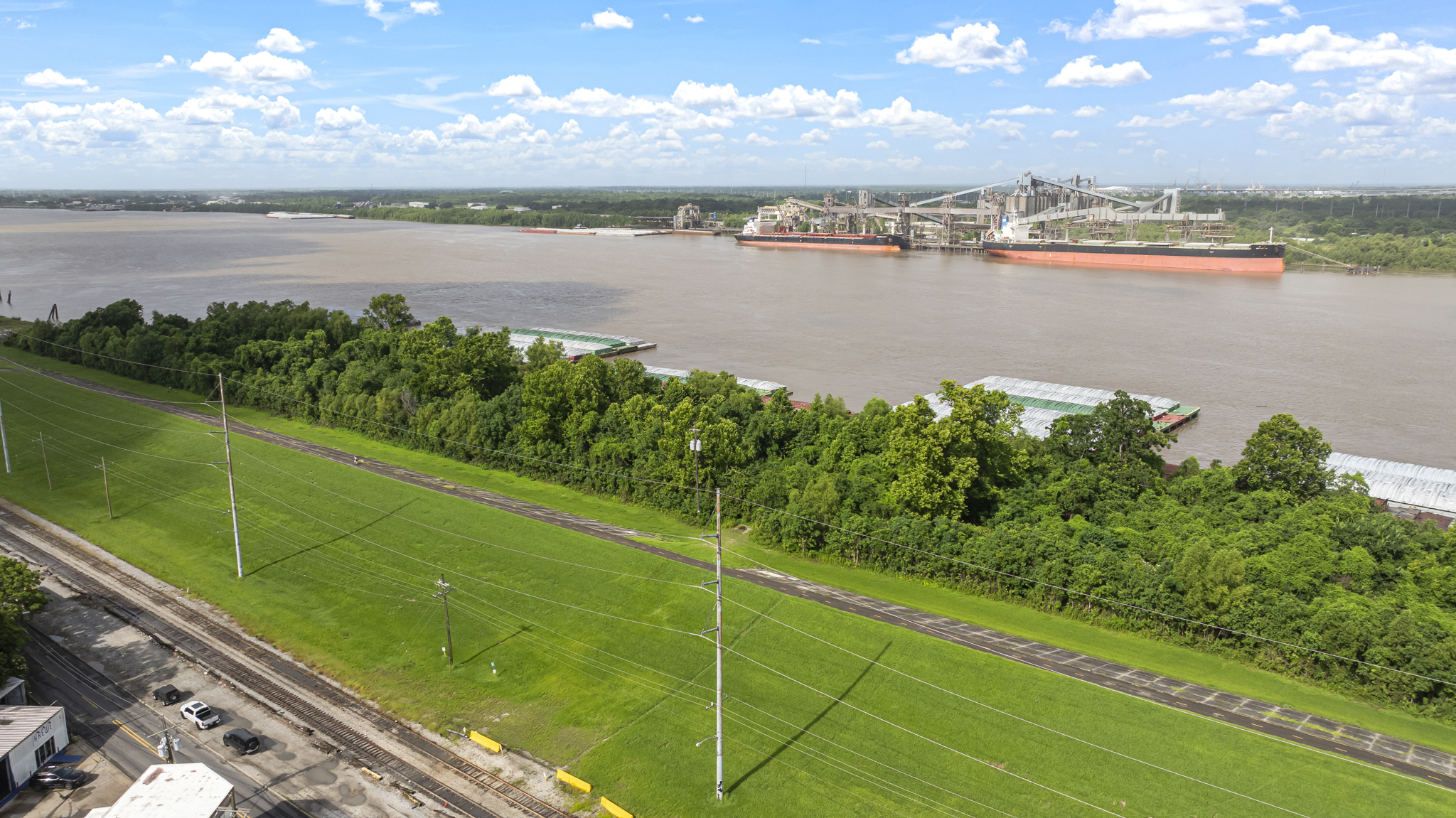 Aerial view of the Mississippi River, grain terminals and barges along the New Orleans riverfront